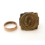 A 1911 gold full sovereign in a 9ct ring mount, size V1/2, together with a 9ct rose gold wedding