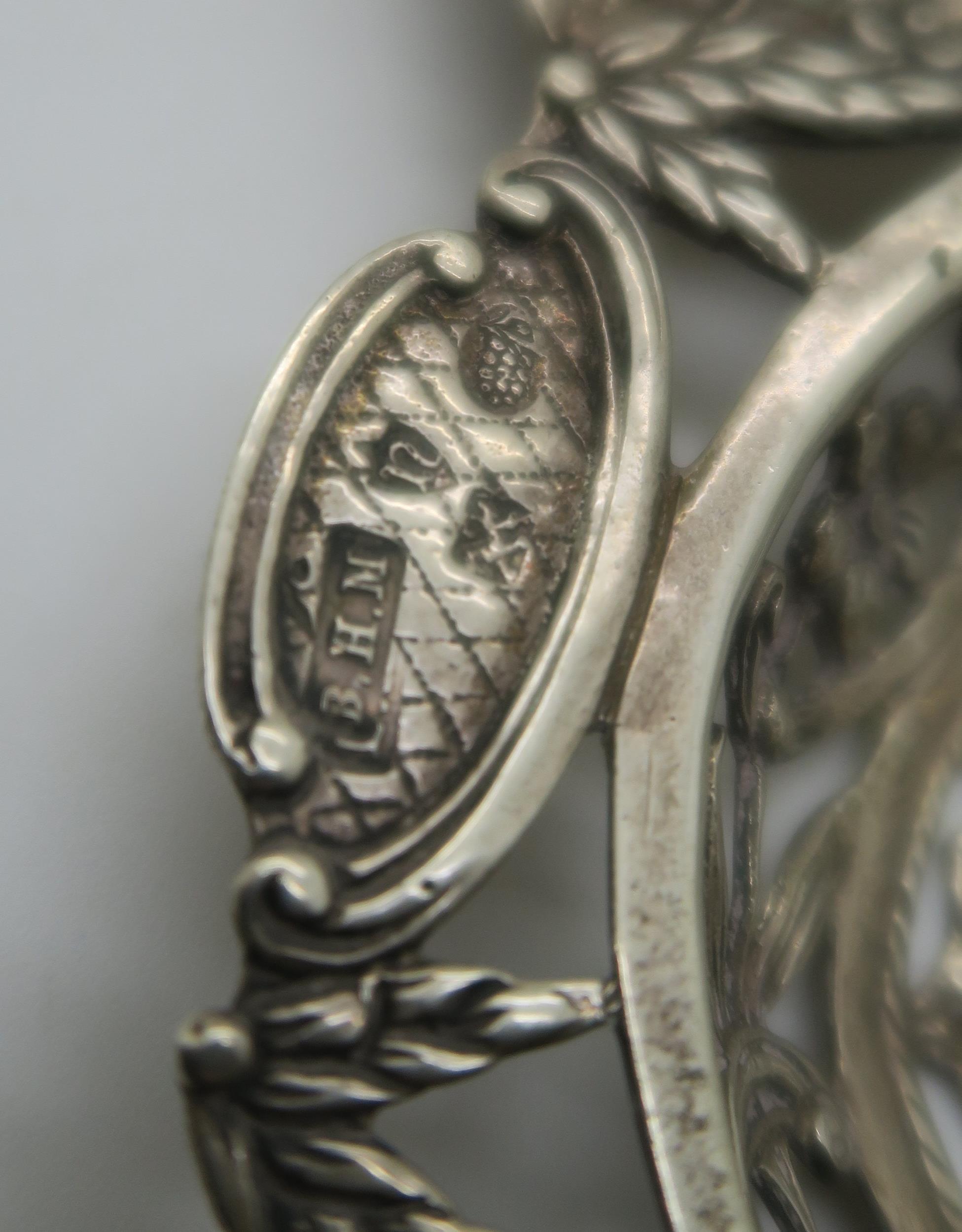 A collection of silver including a silver strainer spoon with pierced and engraved decoration of - Image 2 of 4