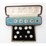 A boxed partial set of 18ct mounted mother of pearl buttons, weight together 9.8gms, together with a