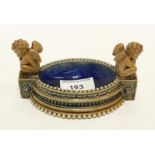 A Doulton stoneware oval salt cellar, moulded with a putti at each end, after George Tinworth,