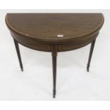 A Victorian mahogany demi lune fold over card table on square tapering supports Condition Report: