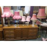 A 20th century brass standard lamp, pair of cast brass table lamps, two further brass table lamps