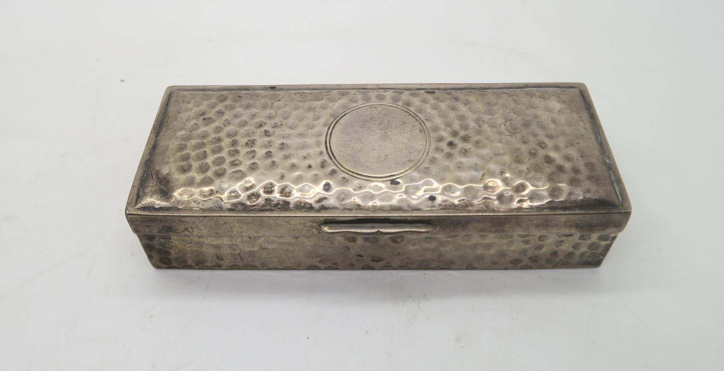An Edwardian silver ring box, of rectangular form with hammered finish, a seven section velvet - Image 2 of 3