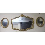 A 20th century gilt framed rococo style wall mirror and two small oval gilt framed wall mirrors (