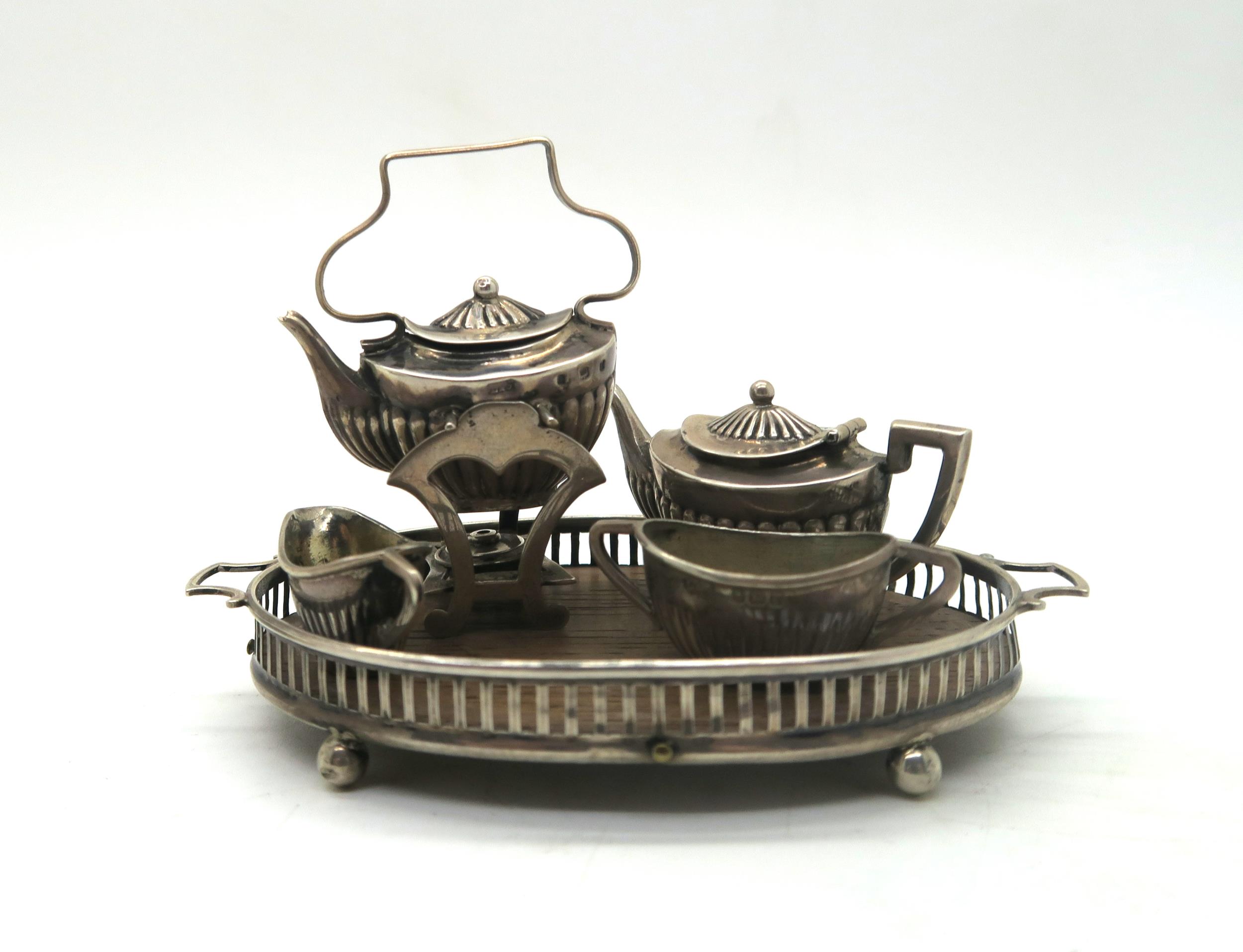 An Edwardian silver dolls house four piece tea service, comprising spirit kettle and stand, - Image 2 of 3