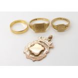 An 18ct wedding ring, size R1/2, weight 2gms, two 9ct signet rings, sizes O and V1/2, and a 9ct gold