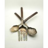 A set of Peruvian silver salad servers, stamped to reverse, with wooden handles (3) Condition