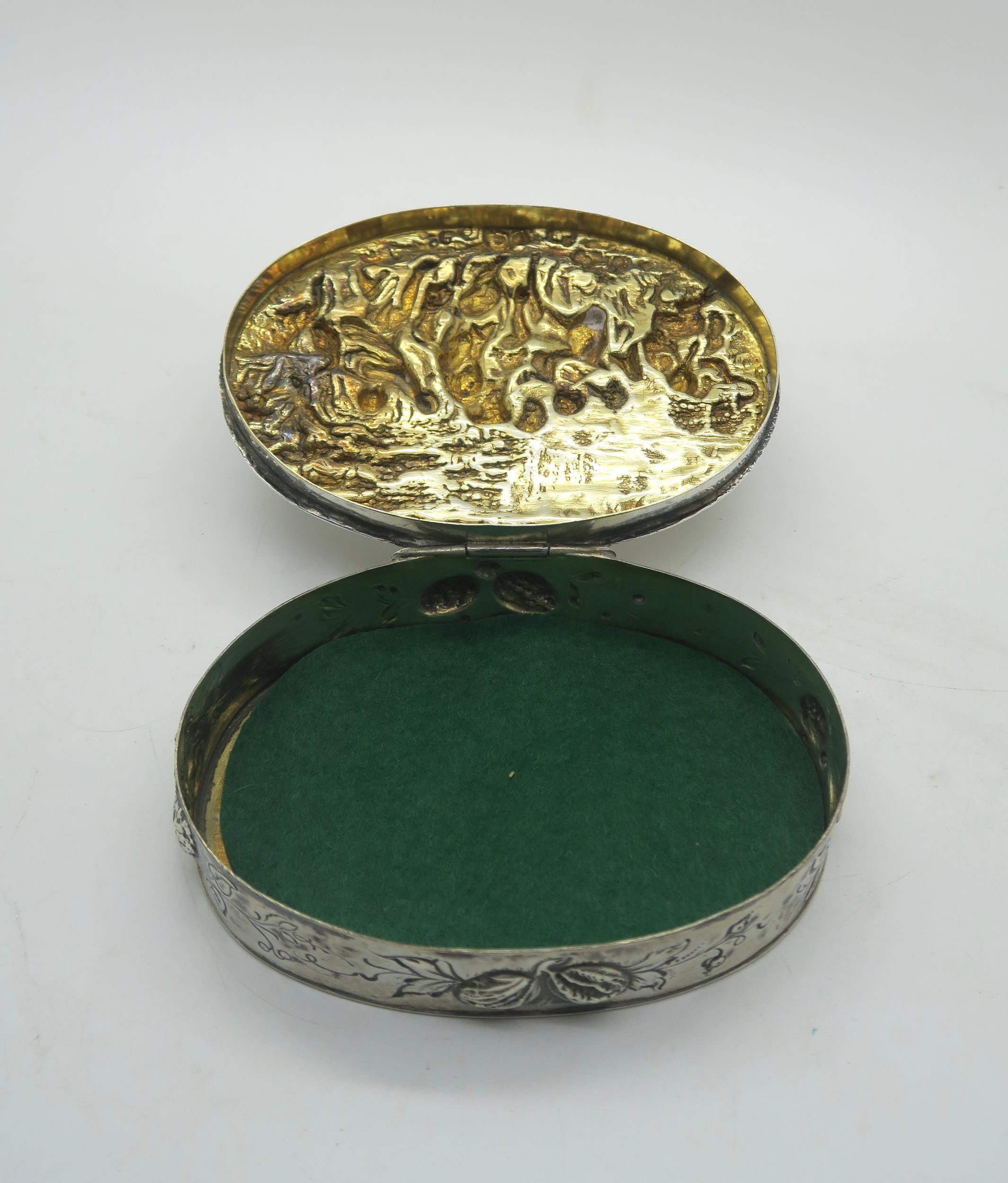 A Continental silver table box, with repousse and chased bacchanalian scenes to the lid, with - Image 2 of 3
