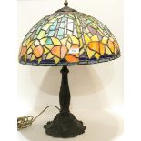 A stained and leaded glass lamp decorated with daffodils Condition Report:Available upon request