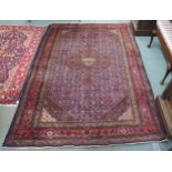 A blue ground Iranian Ardabil rug with central medallion, matching spandrels and red borders,