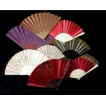 A LARGE GROUP OF FANS comprising mainly coloured satin leaf examples, mounted on bone and wooden