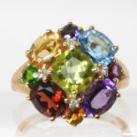 A 9ct gold multi gem set and diamond accent ring, size K1/2, weight 3.5gms Condition Report: