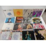 A collection of rare 7" vinyl records with Radiohead -Paranoid Android blue vinyl, Pearl Jam -