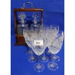 A two decanter tantalus and ten Edinburgh glasses Condition Report:Available upon request