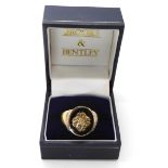 A gold plated silver gents signet ring with knotwork detail and diamond accents, size W, by Brooks &