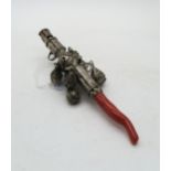 A white metal Victorian baby rattle, the body with engraved floral decoration and coral teether,