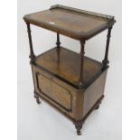 A Victorian walnut music cabinet galleried back top shelf on turned supports above fall front