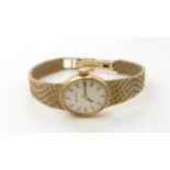 A 9ct gold ladies Mondia watch, weight with mechanism 17.6gms Condition Report:Available upon