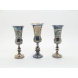 A pair of silver Kiddush wine cups, with engine turned decoration, by J Zeving (or Joseph Zweig),