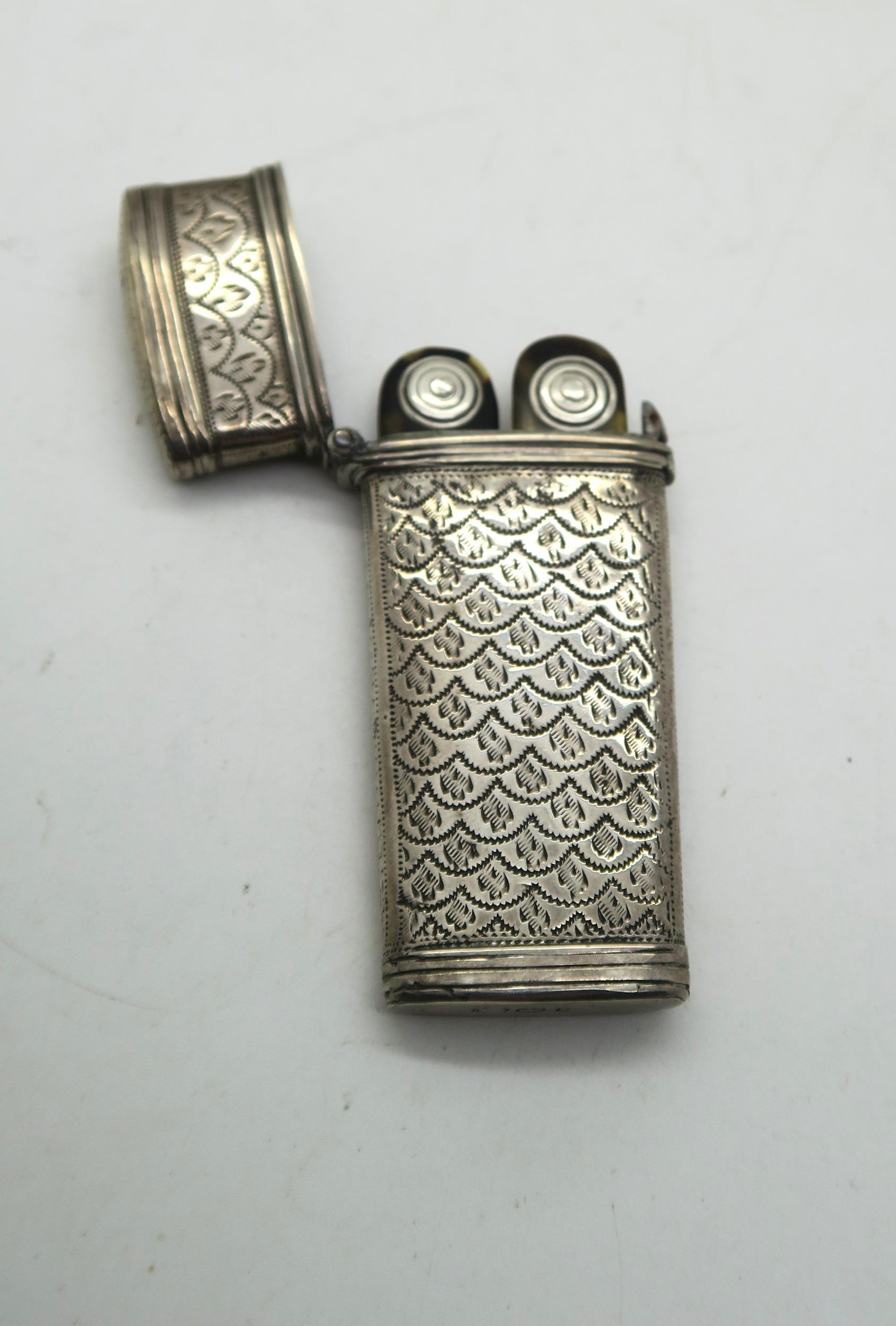 A silver etui, with bright engraved scale motif decoration surrounding an initialled rectangular - Image 3 of 3