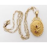 A 9ct decorative locket and chain, the locket set with rubies. Length with bail 4cm, length of chain