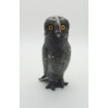 A novelty white metal salt in the form of an owl, with glass eyes (af) Condition Report:one glass
