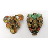 An Oriental revival dress clip by Max Neiger, together with a further floral example Condition