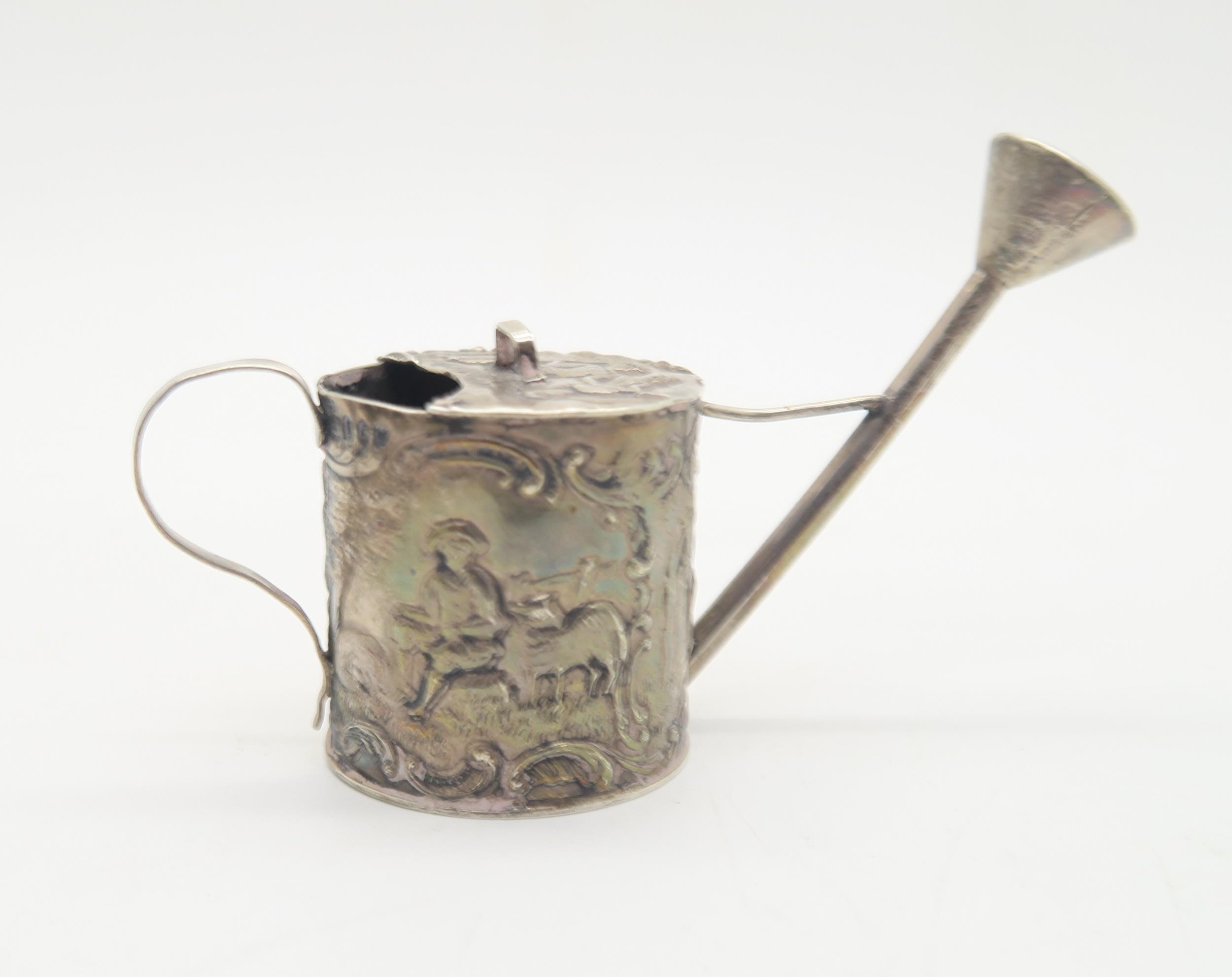 A silver cream jug, with chased and applied decoration of rabbits and birds, with scrolling rim - Image 6 of 6