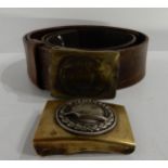 A WW2 German leather belt with brass buckle and an inter war Der Strahlhelm belt buckle depicting