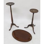 A Victorian mahogany oval serving tray with brass handles and two assorted mahogany plant stands