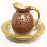A Doulton Burslem wash bowl and ewer, with printed silver chinoiserie decoration over a red ground