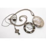 A large silver locket, a white metal pearl set brooch in the style of Bernard Instone and other