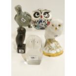 A Hutschenreuther porcelain figure of an owl with mistletoe, other owl figures and a Eskimo carved
