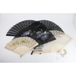 A GROUP OF FIVE 19TH/20TH CENTURY PAINTED FANS one with black chiffon leaf painted with gilt