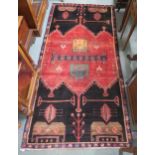 A red ground Meshkin rug with geometric design, 221cm long x 110cm wide Condition Report:Available