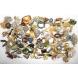 A collection of vintage brooches to include items by Hollywood and Miracle Condition Report:Not