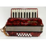 A 22 key 12 bass miniature Galotta accordion Condition Report:Available upon request