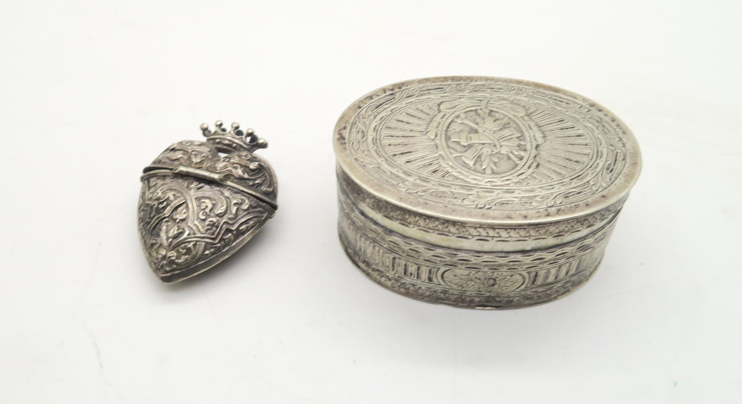 A Danish white metal hovedvandsæg / spice box in the form of a heart, the body with baroque style