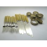 A collection of silver napkin rings including an example by Walker & Hall, Sheffield 1935,