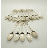 A set of eleven George III Scottish silver fiddle and shell pattern teaspoons, with engraved