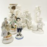 A pottery group of cherubs in the style of Moores, a Meissen white glazed group of a couple and