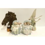 Two Nao figures Giggles with Grandpa and Stories with grandma, another of Flying Herons and a