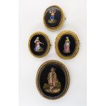 Four micro mosaic brooches, depicting Italian country folk, all mounted in yellow metal mounts