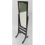 A late Victorian chinoiserie style ebonised cheval mirror, 149cm high x 43cm wide x 42cm deep