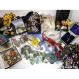 A collection of costume jewellery to include snake bangle and watch, 1960's bowling badges and other