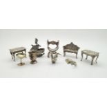 A collection of silver doll's house / miniature furniture, including two tables and a two seater