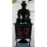 A Victorian ebonised corner cabinet with glazed single door, 172cm high x 64cm wide x 32cm deep