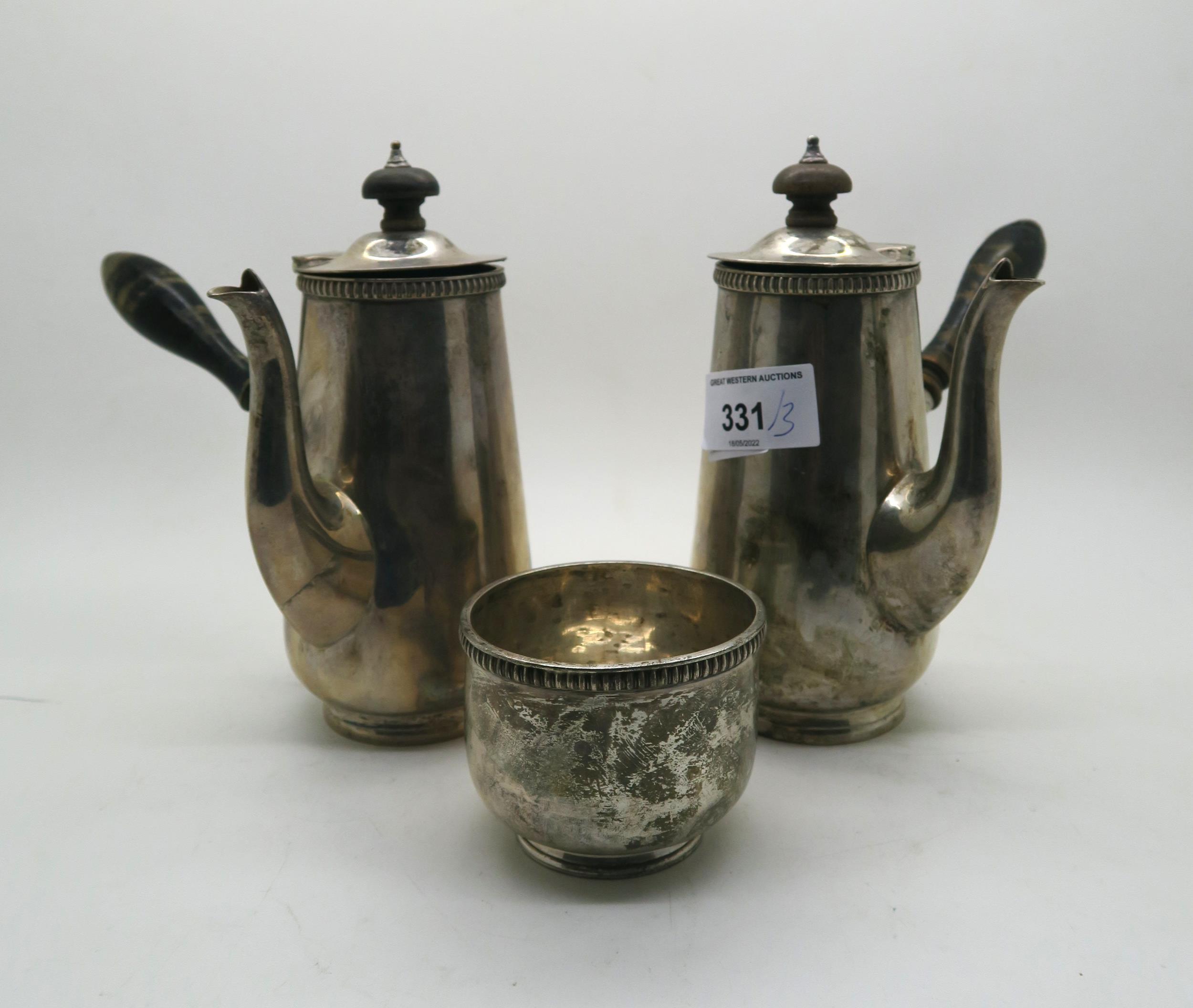 A George V silver cafe au lait set, with turned wooden handles, by Goldsmiths & Silversmiths Co Ltd,