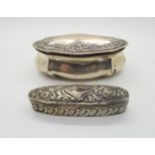 A Victorian silver table box, of lobed oval form with repousse scrolling floral decoration to the