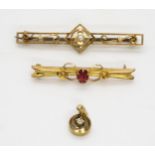 A 9ct gold gem set bar brooch, a German 8ct gold illusion set diamond pendant, stamped 333 and a